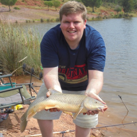 Happy client with a normal barbel